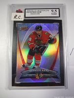Front view of holographic 2008-09 Upper Deck McDonald's Patrick Kane Rookie Card #10 graded 9.5 by KSA in protective case showing player in Chicago Blackhawks uniform.