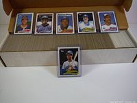 Box of approximately 1000 1989 Topps Baseball trading cards with several displayed on top showing player photos, team logos, and Topps branding.