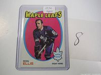 Close-up photo of one 1972 Topps Ron Ellis hockey card for Toronto Maple Leafs, encased in plastic sleeve.