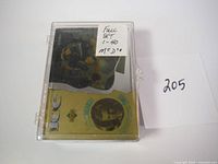 Top view of a closed clear plastic case containing a gold and holographic 1997 Upper Deck Ice hockey card, showing player image and foil accents. Sticker indicates full set 1-40.