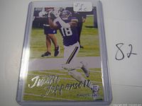 Front of Justin Jefferson rookie card in protective plastic sleeve showing the player in action and name in silver foil.