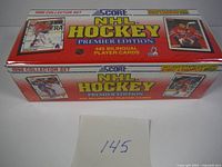 Front and side views of factory sealed box of 1990 Score NHL Hockey Premier Edition set with label showing 445 bilingual player cards and Eric Lindros bonus cards.