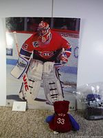 Poster showing Patrick Roy in hockey gear with scoreboard and net in background