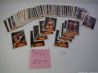 Spread of approximately 70 WWF wrestling cards laid out showing many different wrestlers including Tom Prichard, Freddy Blassie, and others with a handwritten note mentioning 1985 OPC WWF partial set.