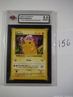 Front of the 1999 Pokemon Pikachu card with red cheeks graded 8.5 NMM+ by KSA.