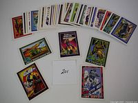 Layout of GI Joe cards fanned to show variety and condition, with some cards clearly visible including 'Snow Serpent' and 'Mobile Missile System MMS'