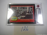 Plastic-encased 1977 Star Wars OPC trading card numbered 81 titled 'Weapons of the Death Star' showing a weapon on the Death Star with Star Wars logo at lower left corner.