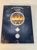 Front cover of the Maple Leaf Gardens auction catalogue showing the building's image and edition number 00465 with price $15.