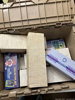 Plastic storage tote with multiple cardboard storage boxes and Topps 1989 complete baseball set box