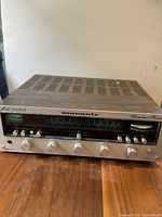 Front view of receiver showing faceplate, knobs, tuning dial and Marantz branding