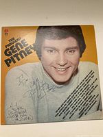 Front cover of The Fabulous Gene Pitney vinyl album featuring a large portrait of Gene Pitney and multiple autographs including his signature and inscriptions.