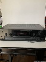 Front image showing full front panel of Sony STR-D590 AV receiver with digital display and control knobs.