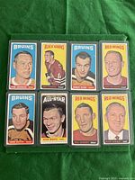 Front of 8 hockey cards from 1964-65 Tall Boys set featuring players from Bruins, Black Hawks, Red Wings.