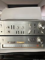 Stacked amplifier and tuner front view showing overall condition