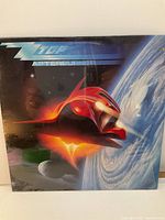 Front cover of ZZ Top Afterburner vinyl LP showing spaceship and space-themed artwork.