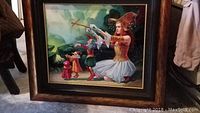 Full front view of the framed dye sublimation art depicting a girl controlling marionette puppets in colorful costume within a dark wood grain copper-colored frame.