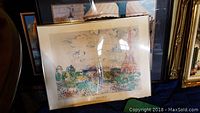 Framed watercolor artwork showing a colorful impressionistic view of the Eiffel Tower and surrounding gardens, signed Raoul Dufy.