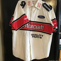 Front view of white and red Ford Motorcraft branded short sleeve shirt with logos and text