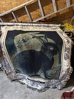 Tapestry or rug featuring two rabbits in a natural setting with fringe on the edges.