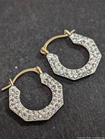 Photo of the front side of the earrings showing cubic zirconia stones detail and latch-back closure.