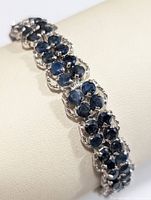 Close-up of sapphire cluster in silver link