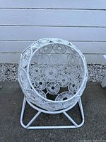Front view of white pet egg chair showing woven circular pattern and metal base.