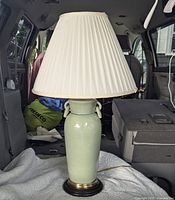 Full assembled lamp with shade in vehicle interior