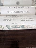 Close-up image showing the GP & J Baker Broughton Rose label with design number and roll size details.