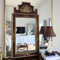 Full frontal view of mirror in room setting showing overall pagoda shape and frame detail