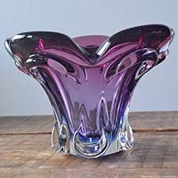 Front view of purple and clear glass bowl showing the shape and color gradient.
