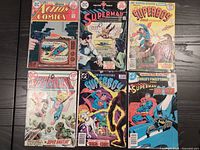 Lot of 6 vintage DC comic books showing front covers with main characters Superman, Superboy, Supergirl, Batman.