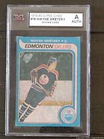 Front of the protective slab showing the 1979-80 O-Pee-Chee #18 Wayne Gretzky rookie card and KSA authentication label