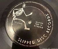 Close-up of Slipped Disc Records label with skeleton graphic and record details on the vinyl