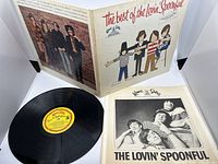 Gatefold album cover open showing front illustration and vinyl with yellow Kama Sutra label along with black-and-white band photo inner sleeve.