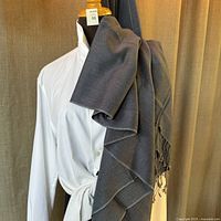 Gunmetal grey pashmina shawl draped on mannequin showing fabric and style