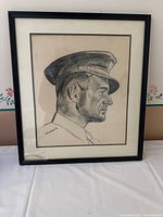 Full view of framed pencil portrait of army officer, signed Banasewicz. Glass broken bottom left corner.