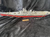 Full view of USS Missouri 20-inch long model ship showing side profile with detailed superstructure and red hull bottom.