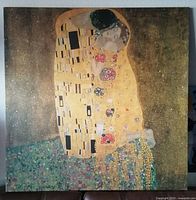 Front view of the large canvas print of The Kiss by Gustav Klimt, showing the iconic figures and golden decorative background.