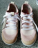 Front view of Clarks women's sneakers showing pink mesh toe area with suede overlays and lace-up closure.