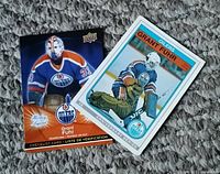 Photo showing front of two Grant Fuhr hockey cards: one 1982/1983 O-Pee-Chee card and one 2009/2010 Upper Deck McDonald's checklist card.