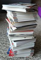 Stack of hockey sports cards arranged on carpet, showing thickness and size of the collection.