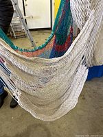 Close-up of beige hammock chair fabric and multicolor chair background