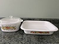 Both Corningware cookware pieces side by side showing Harvest pattern on sides.