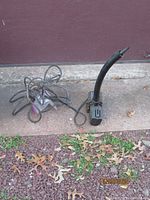 Photo of black Atlantic magnetic drive water pump with attached power cord, showing overall condition and features.