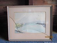 Framed watercolor seascape by Paul M. Shearer showing the full frame with visible cracked glass.