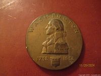 Obverse side of George Washington Bicentennial Medal showing profile bust, 1732-1932, and inscription 'WASHINGTON'