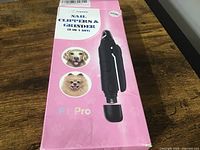 Photo of the box packaging showing the Fuguigui brand and 2-in-1 nail clippers and grinder with pet images