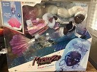 Mermaze Mermaid doll in box showcasing color change tail and winter-themed outfit.