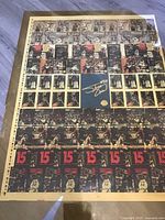 Full view of the large uncut press sheet with multiple images of basketball player Shag, showing center gold signature and gold seal