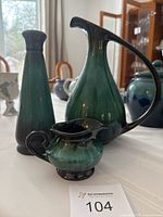 Three Blue Mountain Pottery pieces: vase, pitcher, and creamer bowl shown on a table